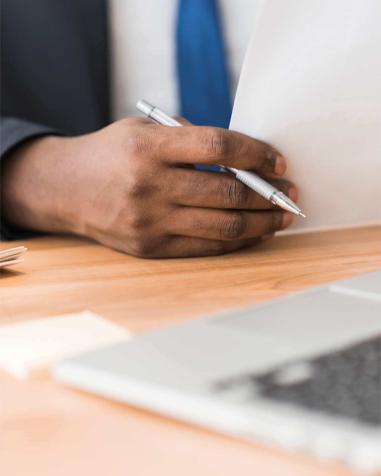 Business professional reviewing documentation with client